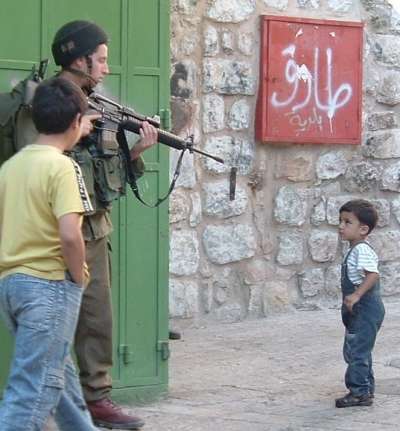 Palestinian child and Isreali soldier